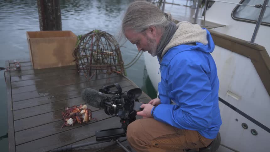 A footage of a person filming at the dockyard