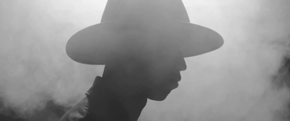 Man stands outside in the fog