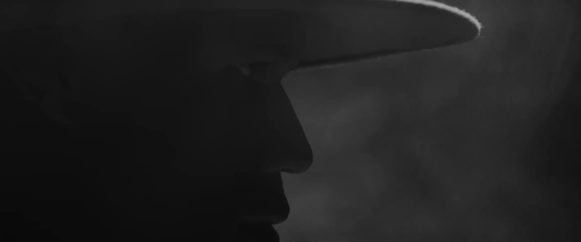 Silhouette of a man looking right