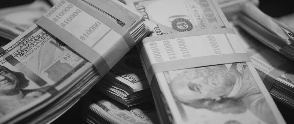 Close up of hundred dollar bills wrapped in paper