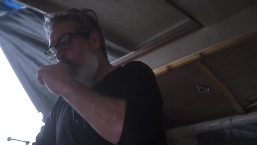 A footage of a man flossing