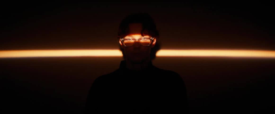 A footage of a person standing indoor