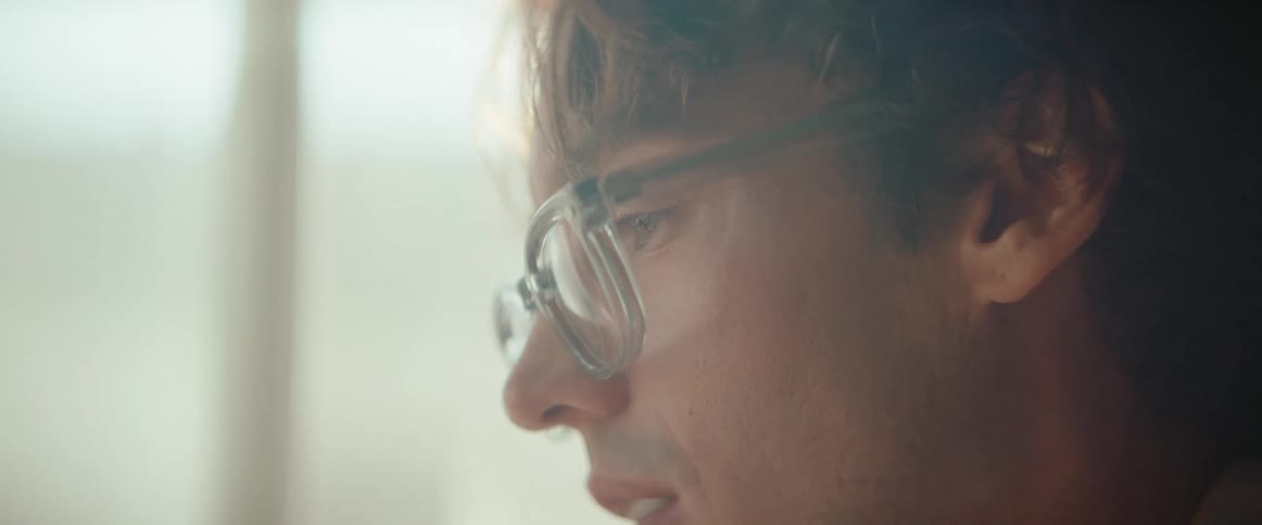 Side portrait of a man wearing glasses