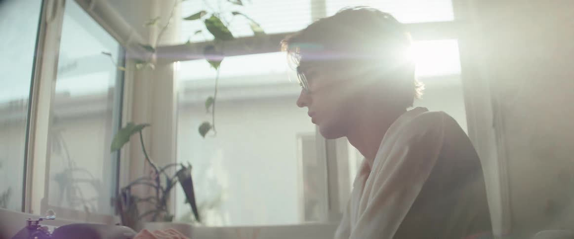 Man typing on a vintage typewriter