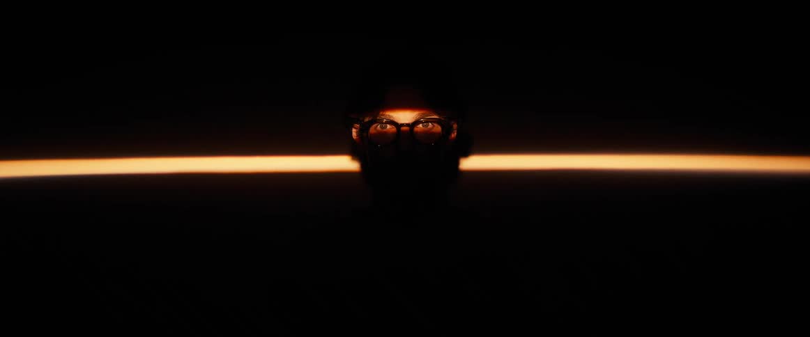 Beam of light in the eyes of a person wearing glasses