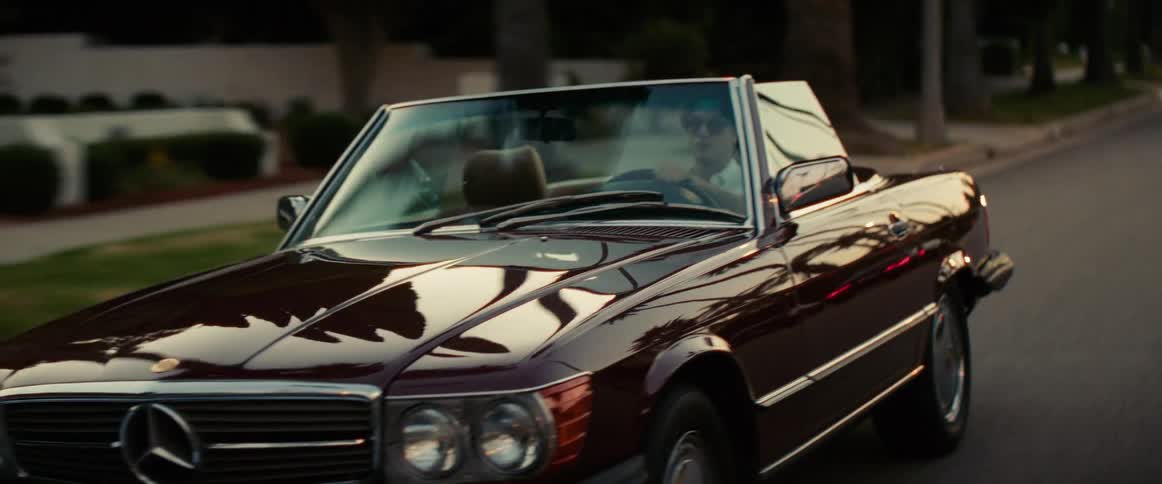 Man driving a convertible vehicle