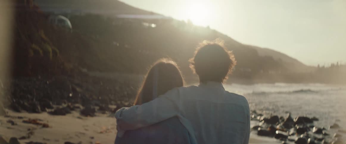 A footage of romantic partners playing by the sea side