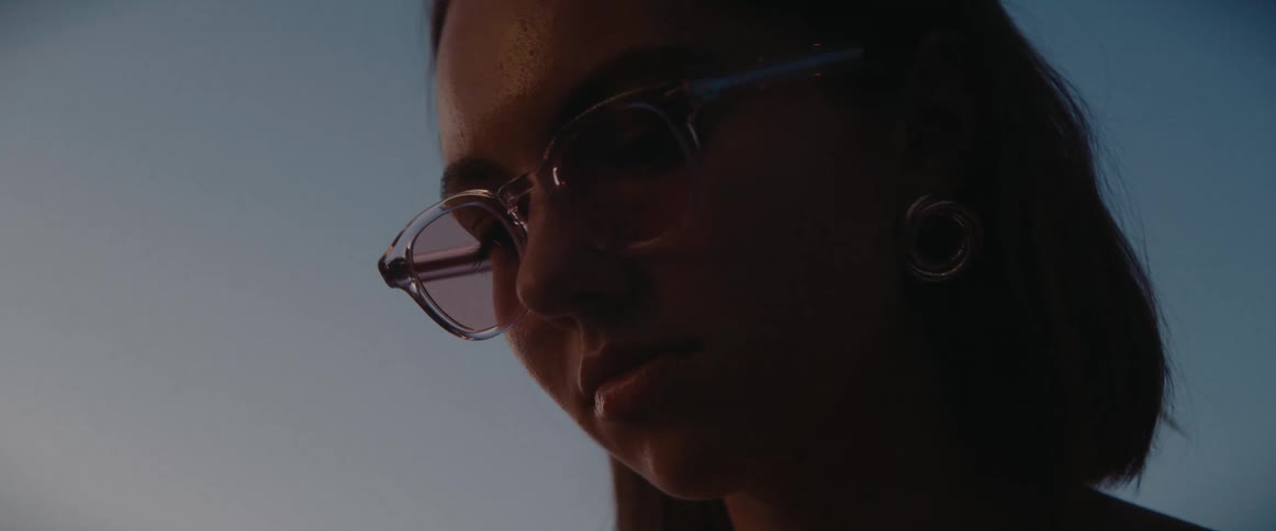 Portrait of a woman with glasses outdoors