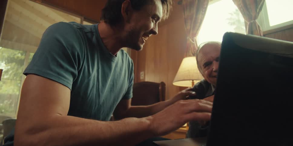 A footage of an elderly man and a man having fun