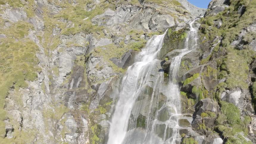 Landscape of a waterfall on a mountain with mosses