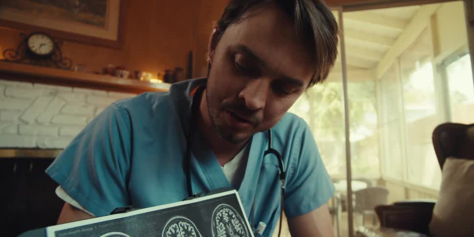 Nurse showing a report of a brain