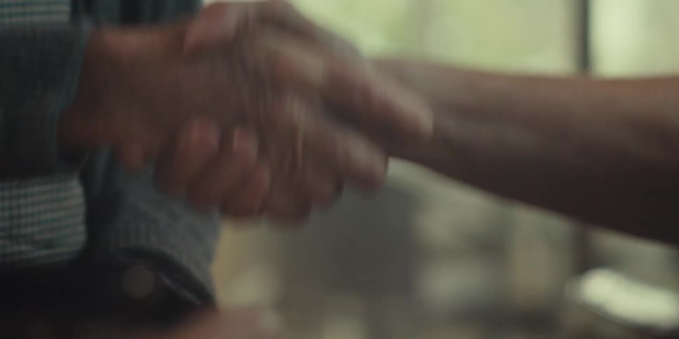 Pair of hands of two people greeting each other