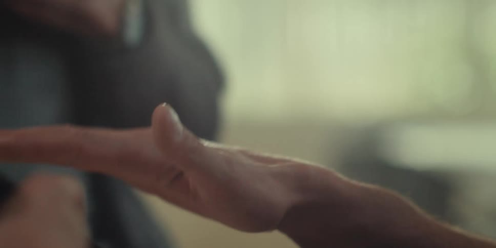 A person is pointing their finger while they talk