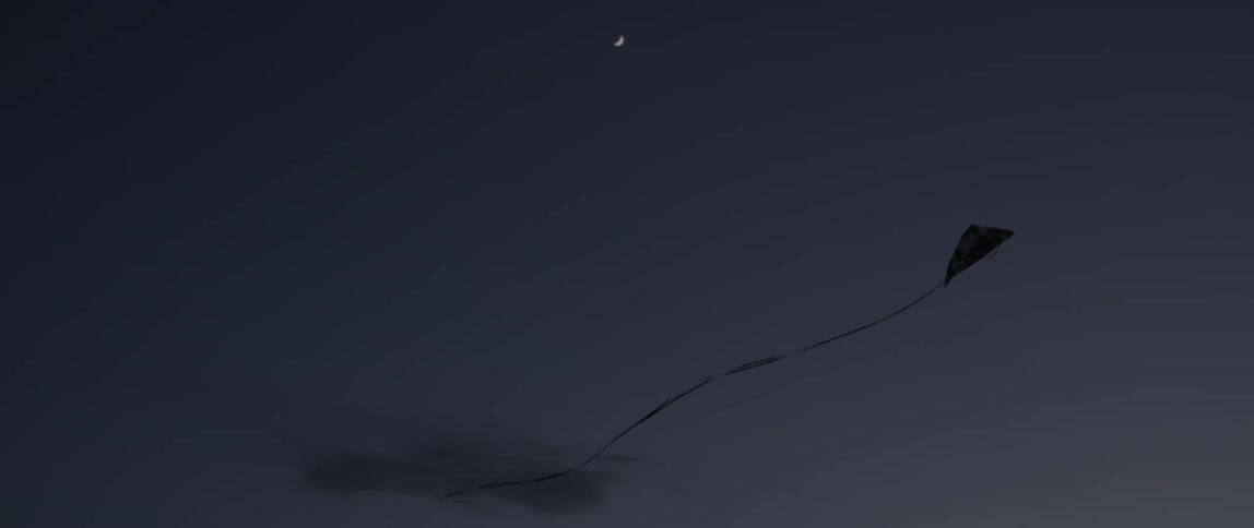 A kite is flying in the dawn sky