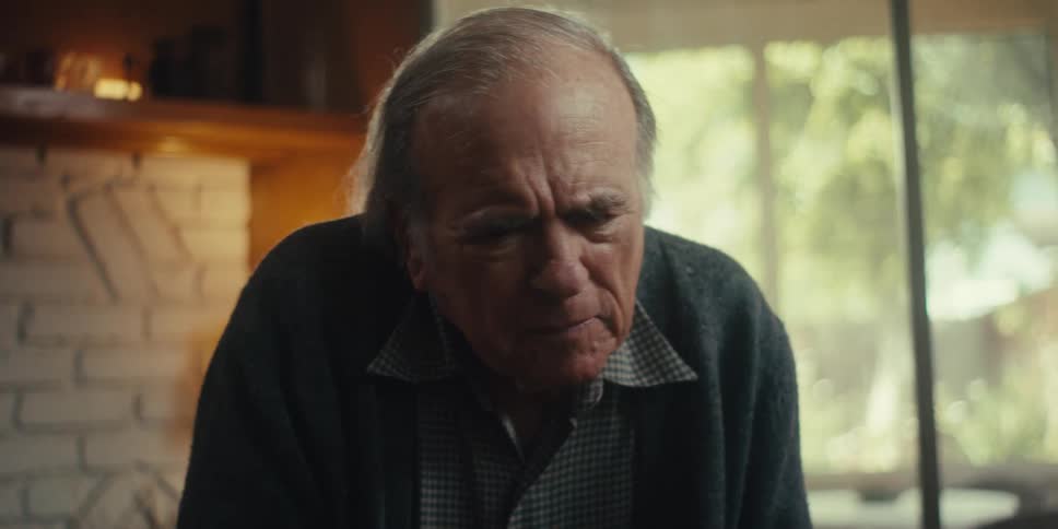 Elderly man paying attention to a persons hands