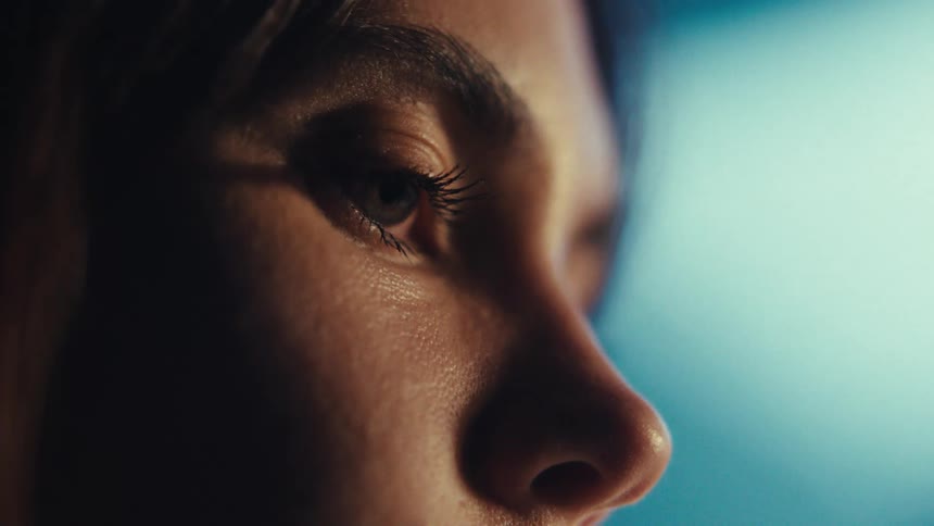 A woman is blinking her eye