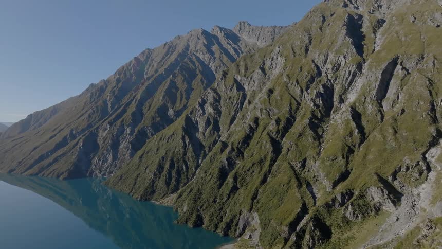 Imposing mountains on the edge of a lake