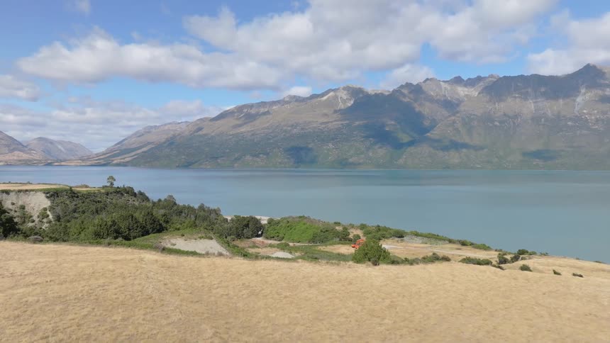 Aerial view of mountains on the edge of a lake