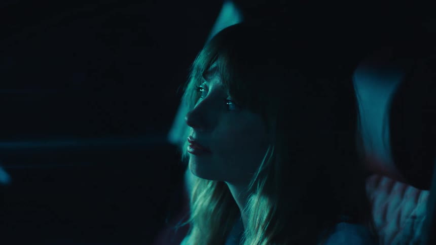 Woman inside a vehicle at night