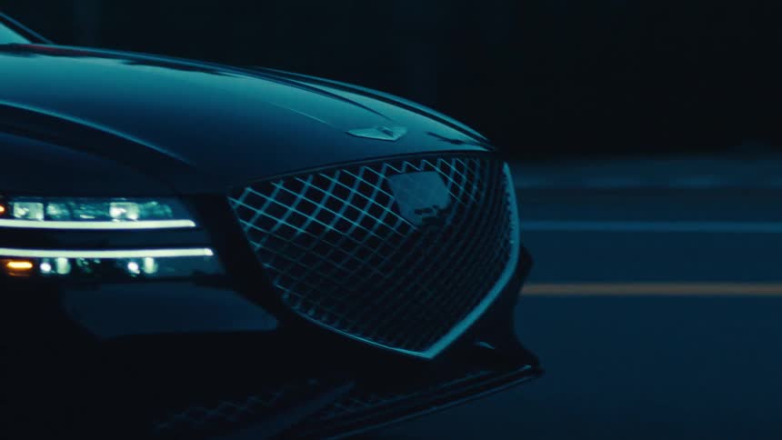 A car is driving at sunrise