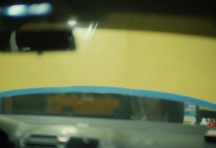 Man getting out of car and opening the hood