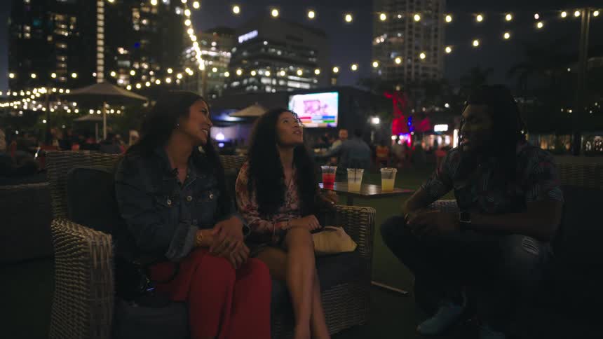 Friends are talking at a outdoor nightclub