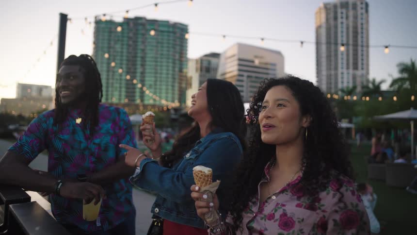 Friends eat ice cream outside