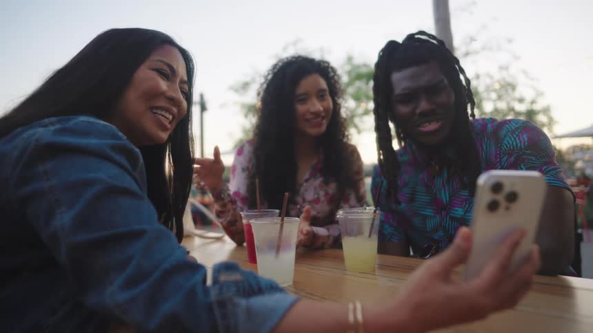 A footage of people having a drink and a selfie