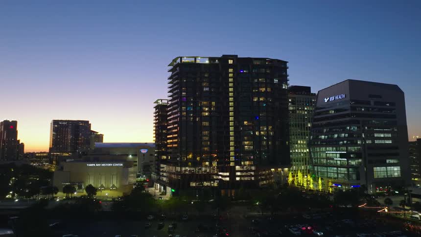 The city is dark at sunset