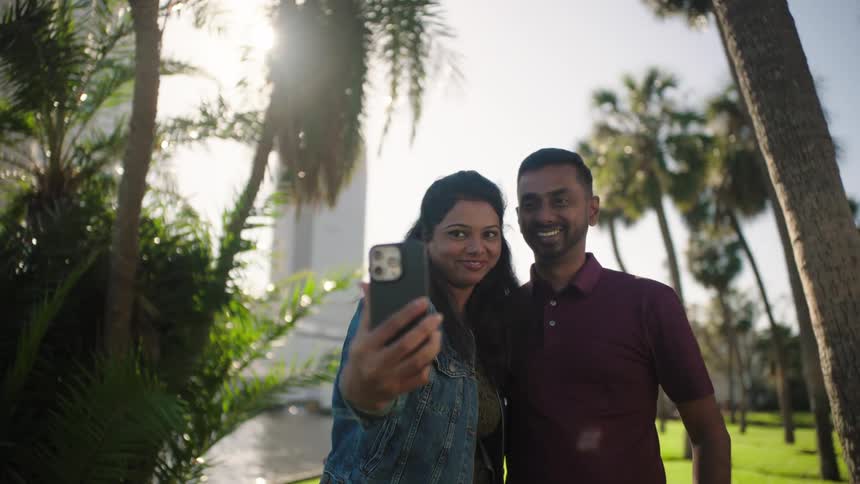 Smiling woman and man taking a selfie