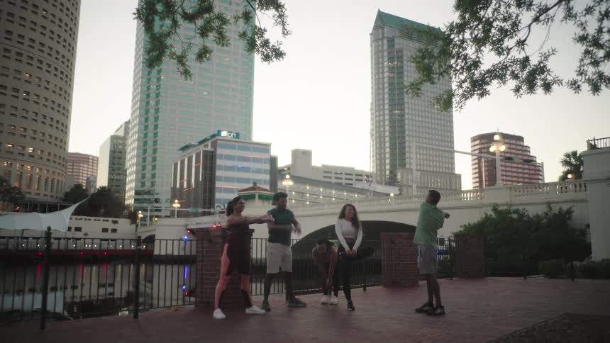 Group of people outdoors stretching their bodies