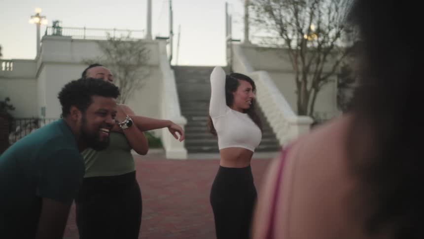 Group of people performing body stretching
