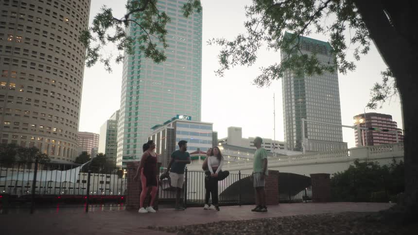 Small group of people stretching in a city park