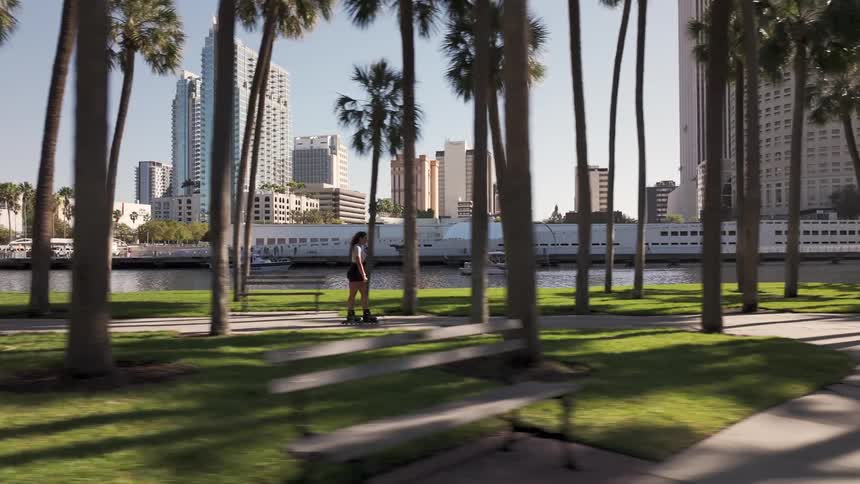 A woman is rollerblading in the park