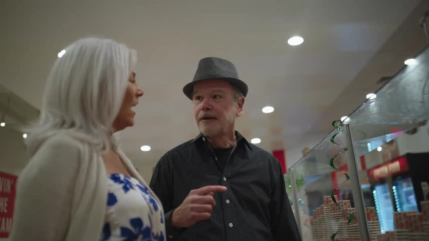Woman and a man in an ice cream shop talking