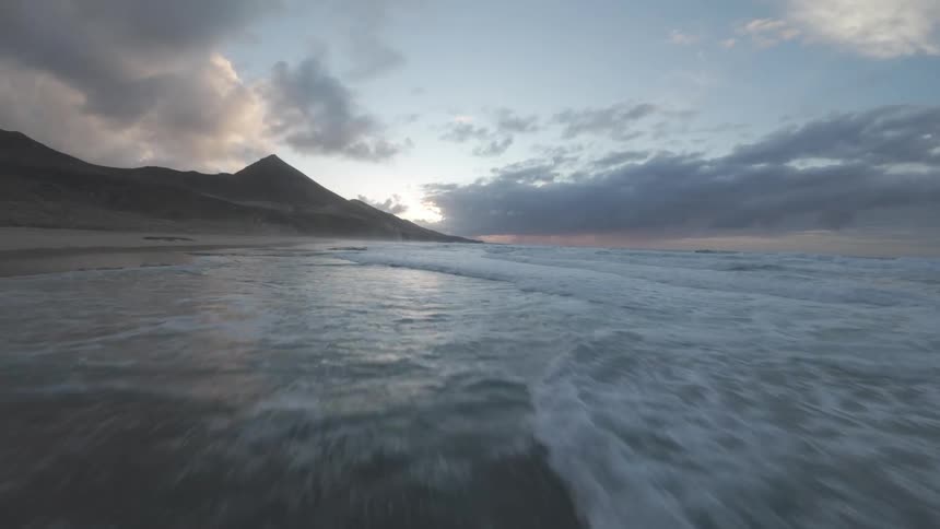 The tide is moving over the sand