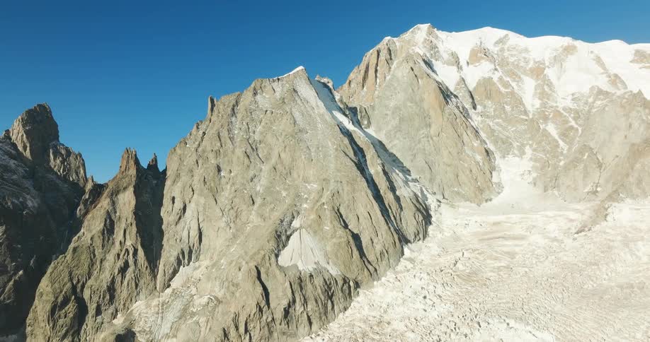 Mountain scenery with cliffs against blue sky