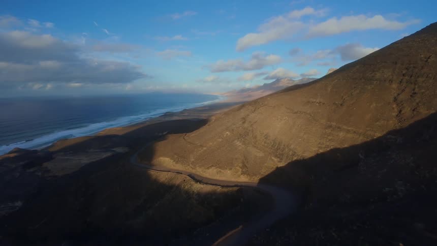 A trail on the mountain leads to the beach