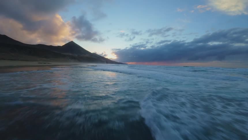 The sky is reflecting on the wet sand