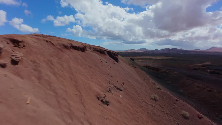 The landscape is full of brown hills