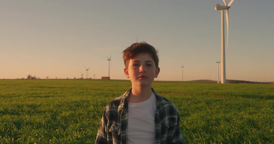 A footage of a boy standing in the fields