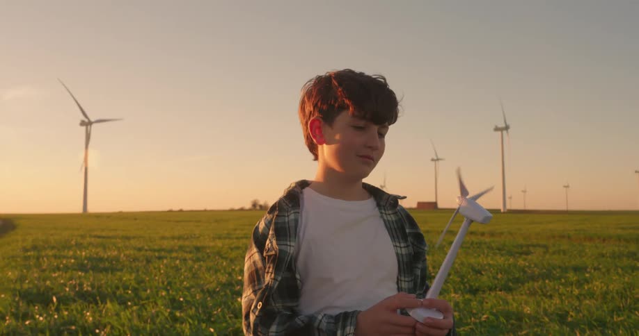 A footage of a boy holding a toy