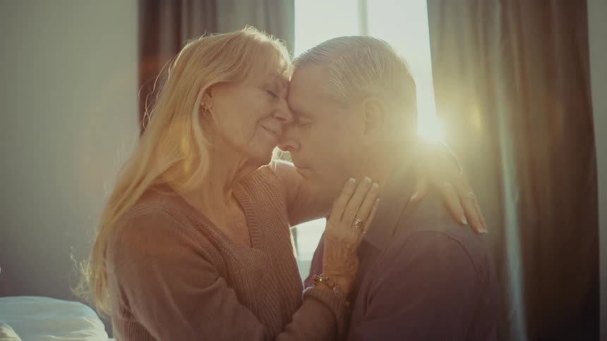 A footage of a man and woman having a romantic moment indoor