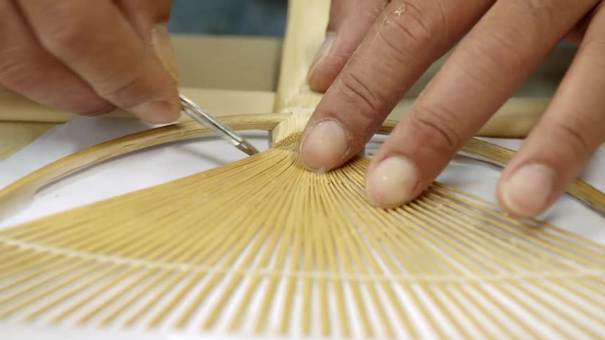 A person is building a fan