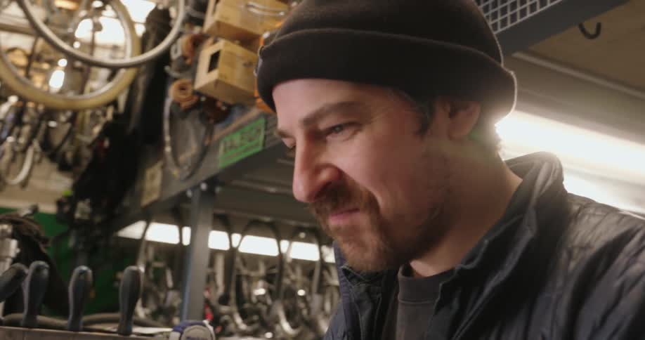 A worker is talking in the bike shop
