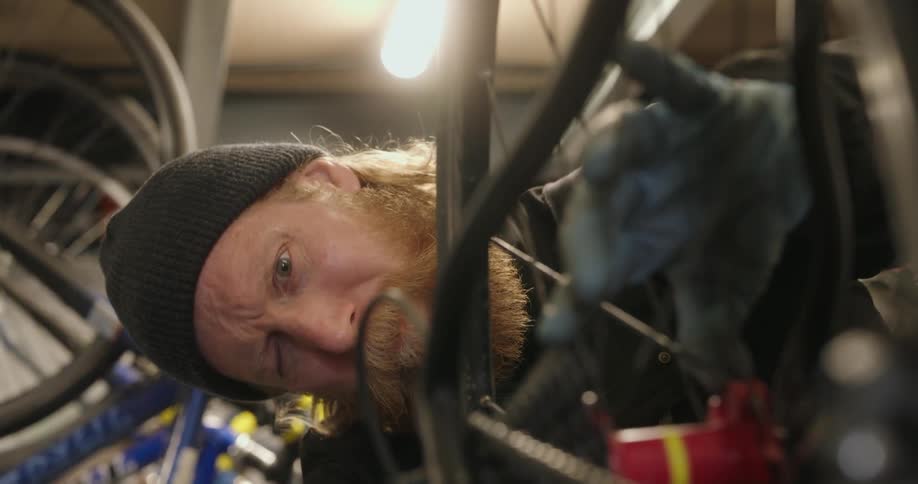 A man is repairing a bike tire