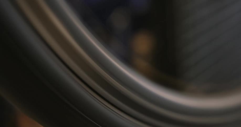 A close up of a spinning bicycle wheel