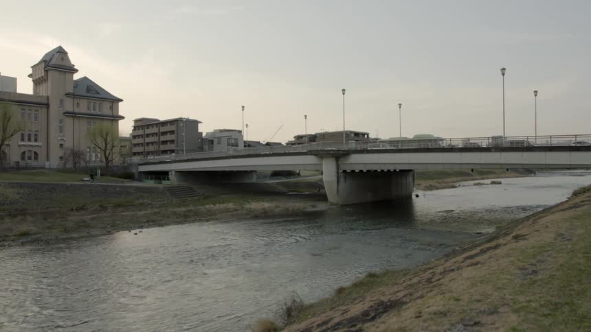Water flowing in a waterway under a bridge