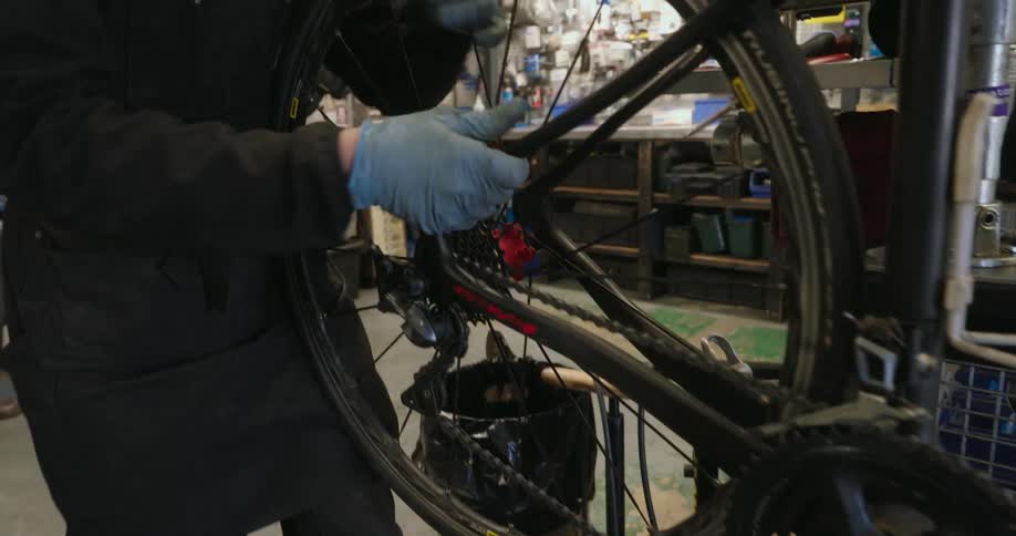Man fixing the frame of a bicycle