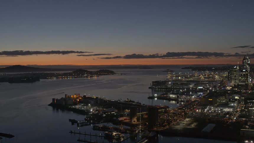 Aerial of a harbor in a metropolis at sunset